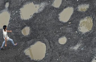 The Reflective Lens of Potholes: Examining Government Priorities from Kerala to New York