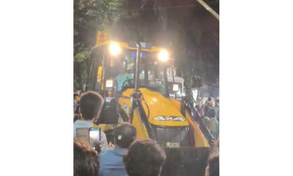 Protests Erupt as Bulldozer Attempts to Remove CPI(M) Book Stall in Jadavpur During Durga Puja